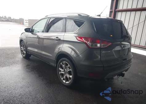 2014 Ford Escape Titanium z USA, uszkodzony, nr VIN 1FMCU0J91EUE57538
